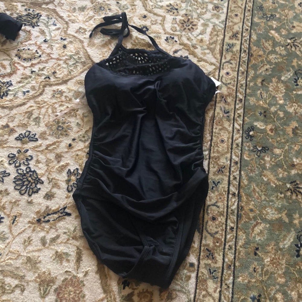 Black small one piece bathing suit.